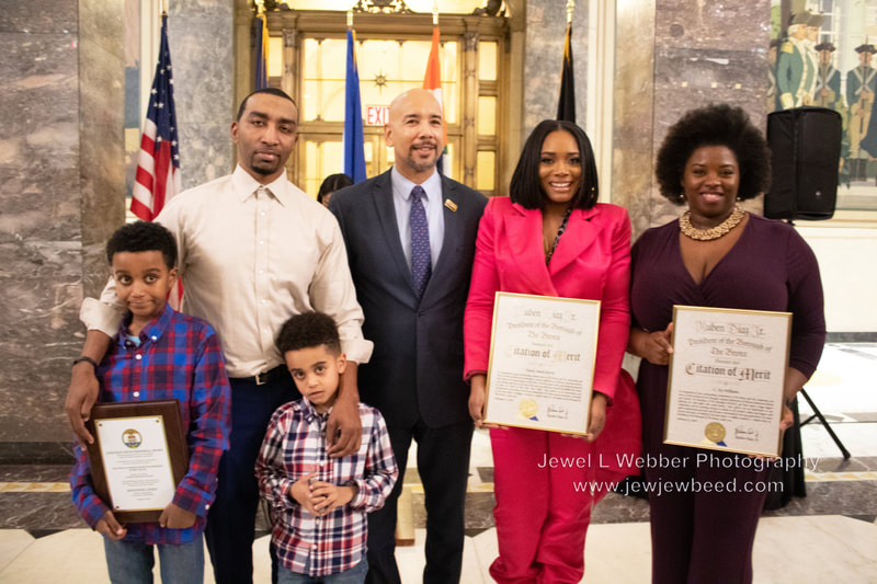  Awardees With Family and Borough President 1.Son of Mysonne Linen holding his Dad's award 2.Mysonne Linen (Jonathan Hicks Memorial Award Recipient, Founder of Raising Kings
and Co-Founder of Until Freedom)  3. Son of Mysonne Linen 4.Bronx Borough President Ruben Diaz Jr. 5.Yandy Smith-Harris Entrepreneur, TV Personality, Philanthropist
 6.L. Joy Williams(President, NAACP Brooklyn Chapter)